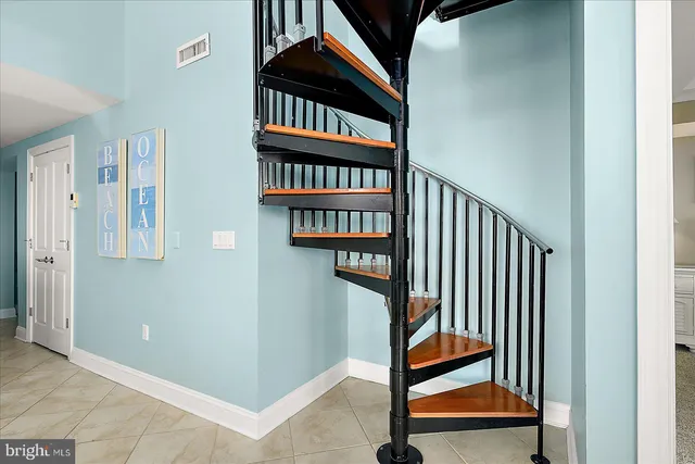 a view of a balcony with a table and chairs
