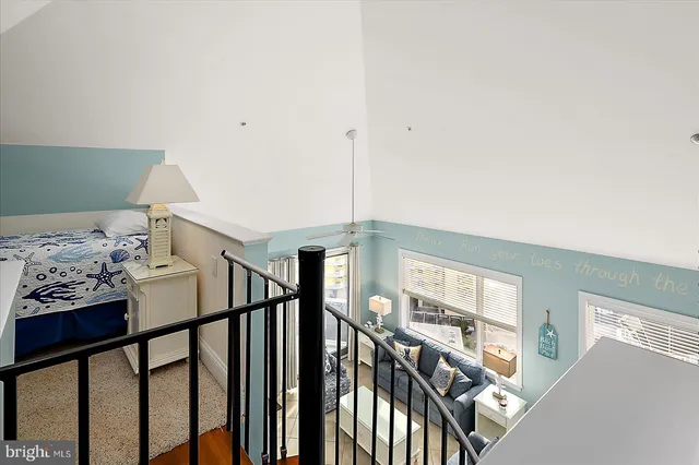 a view of a balcony with a table and chairs