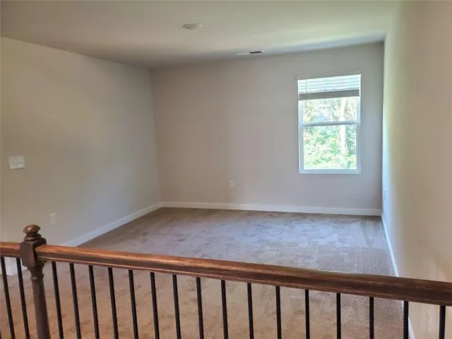 a view of a hallway with a window