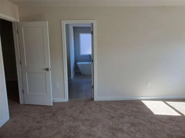 an empty room with a bathroom