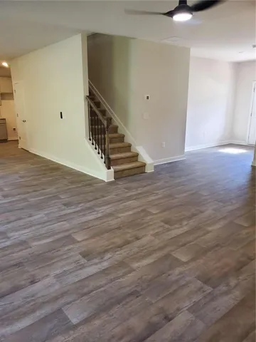 a view of an entryway with wooden floor
