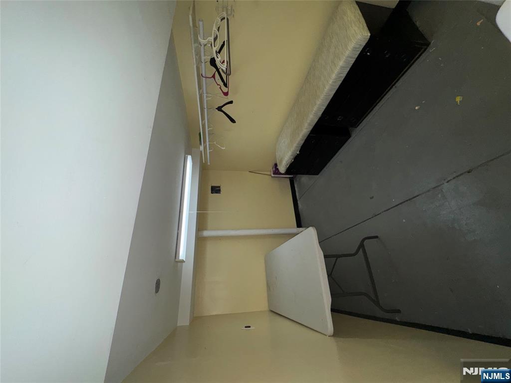 438 4th Street, Unit 1 Carlstadt, NJ 07072 - Photo 11 of 11 a room with car parked