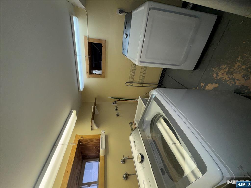438 4th Street, Unit 1 Carlstadt, NJ 07072 - Photo 10 of 11 a utility room with dryer and washer
