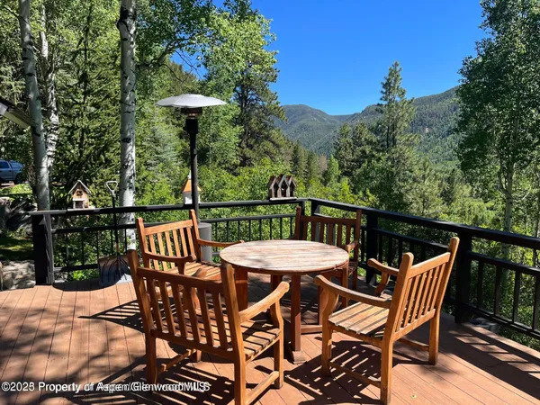 a view of a table and chairs in patio