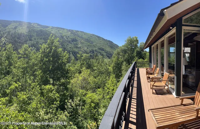 a view of balcony with furniture
