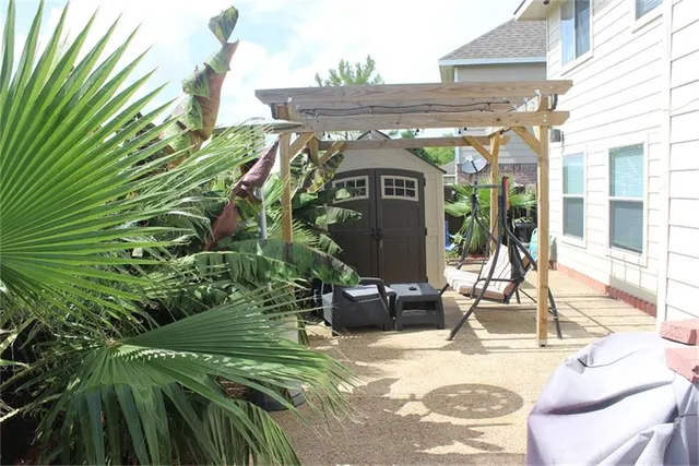 a view of a chairs with potted plants