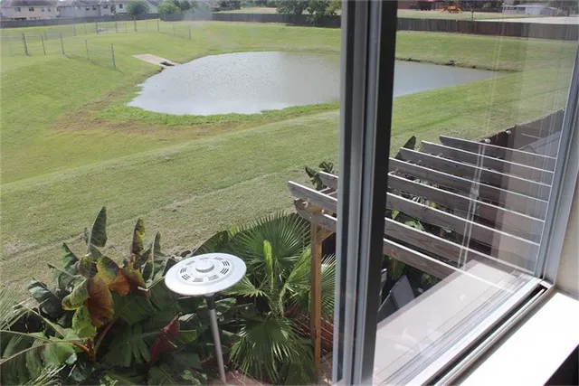 a view of a lake from a balcony