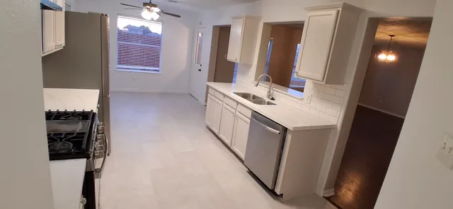 a bathroom with a sink a mirror and a shower