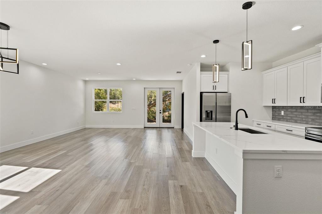 2956 West Higgins Place Dunnellon, FL 34433 - Photo 17 of 52 a view of a kitchen with a sink and wooden floor