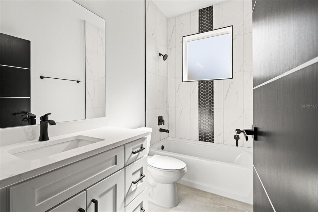 2956 West Higgins Place Dunnellon, FL 34433 - Photo 37 of 52 a bathroom with a sink a toilet and shower