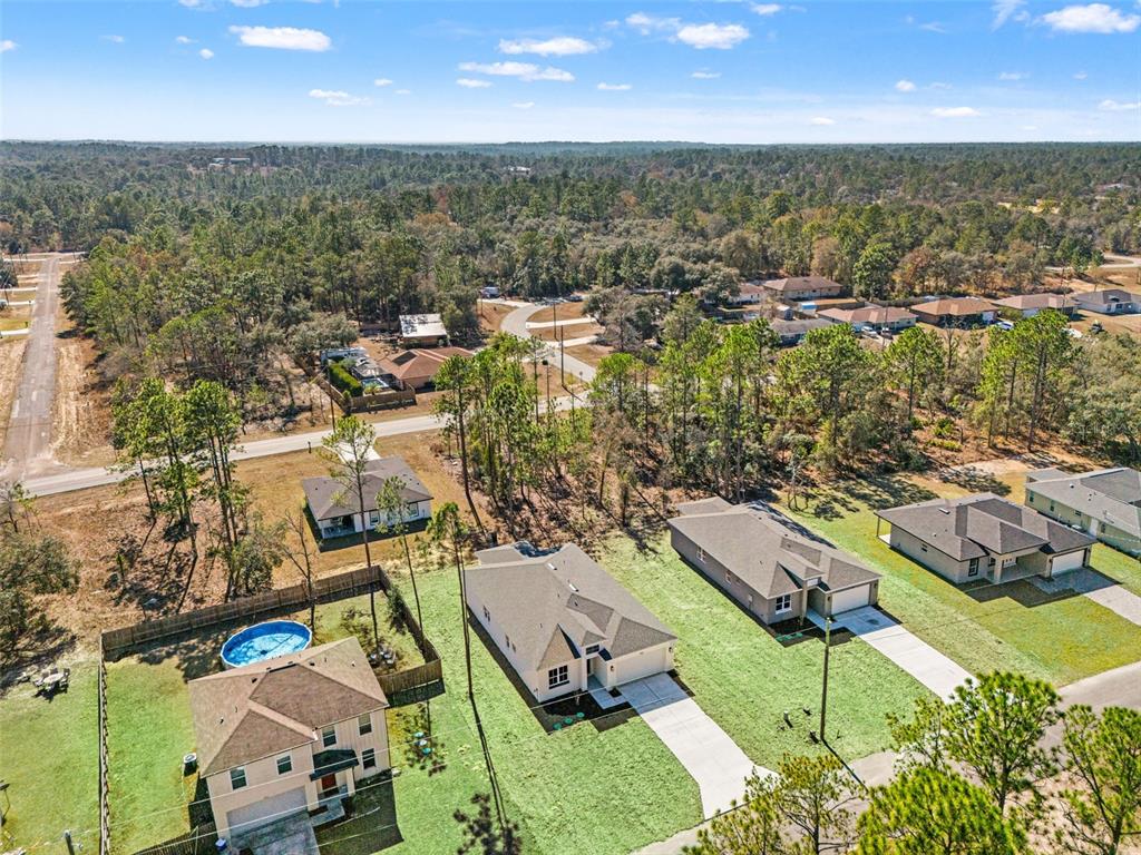 2956 West Higgins Place Dunnellon, FL 34433 - Photo 4 of 52 an aerial view of a residential houses with outdoor space