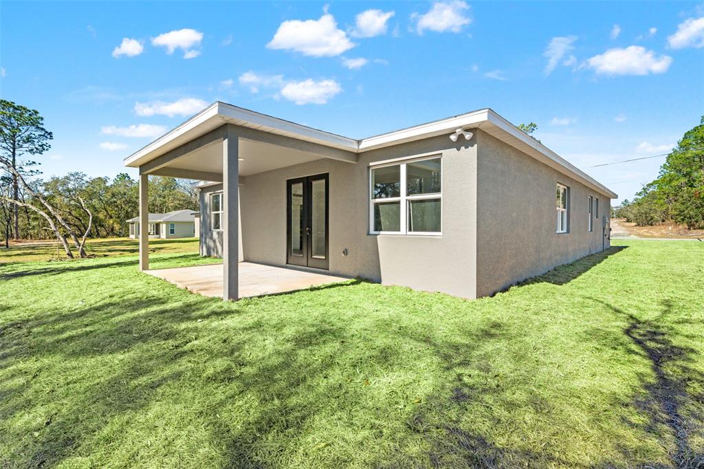 2956 West Higgins Place Dunnellon, FL 34433 - Photo 47 of 52 a house view with a garden space