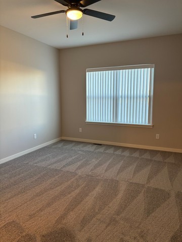 609 Anjali Court, Unit L Sycamore, IL 60178 - Photo 13 of 20 an empty room with a window