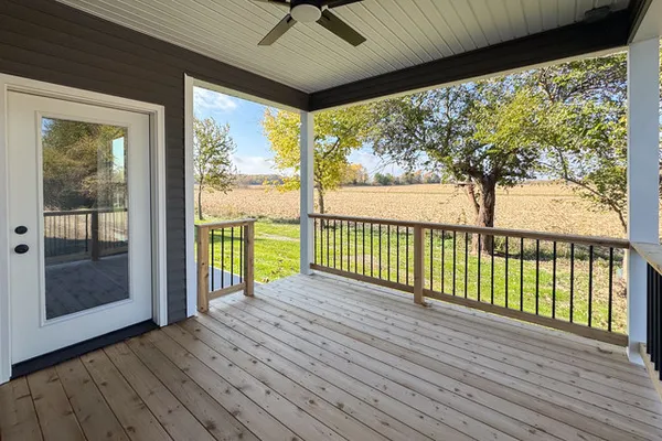 a view of a room with wooden floor and outdoor space