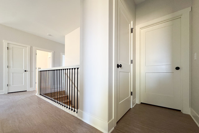 609 Anjali Court, Unit L Sycamore, IL 60178 - Photo 6 of 20 a view of a hallway with closet area