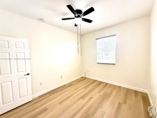 a view of a park with large trees