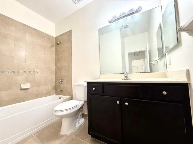 a view of a swimming pool with a table and chairs