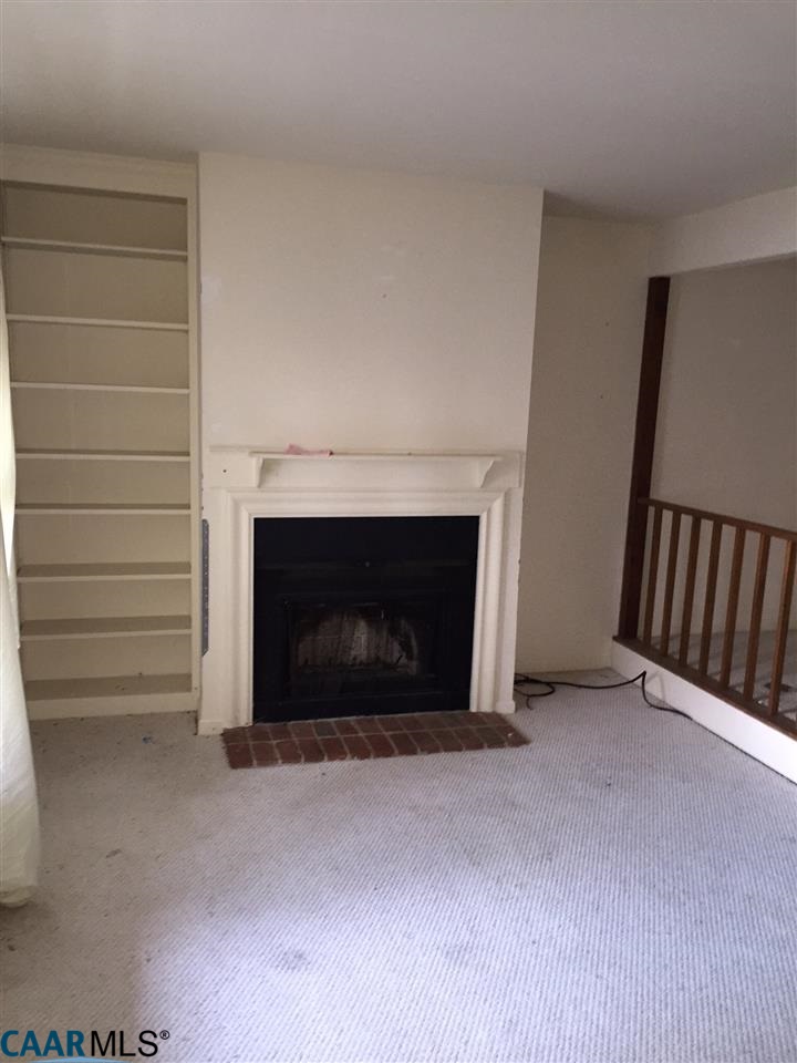 1623 Cool Spring Road Charlottesville, VA 22901 - Photo 3 of 5 a view of empty room with a fireplace