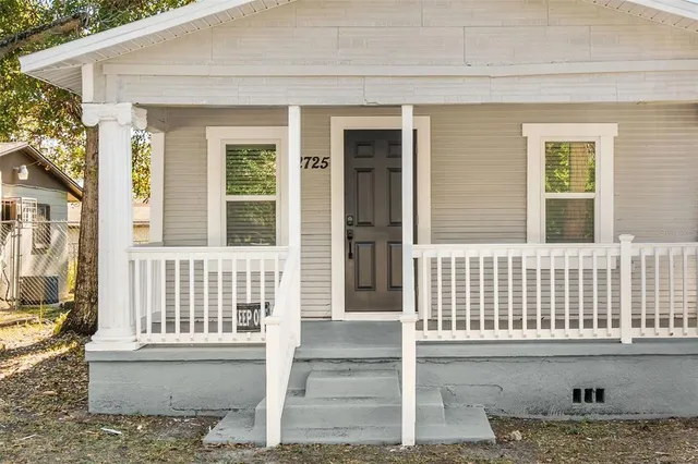 a front view of a house with a porch