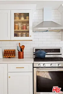 a kitchen with a stove and a microwave