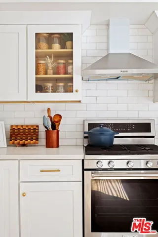 a kitchen with a stove and a microwave