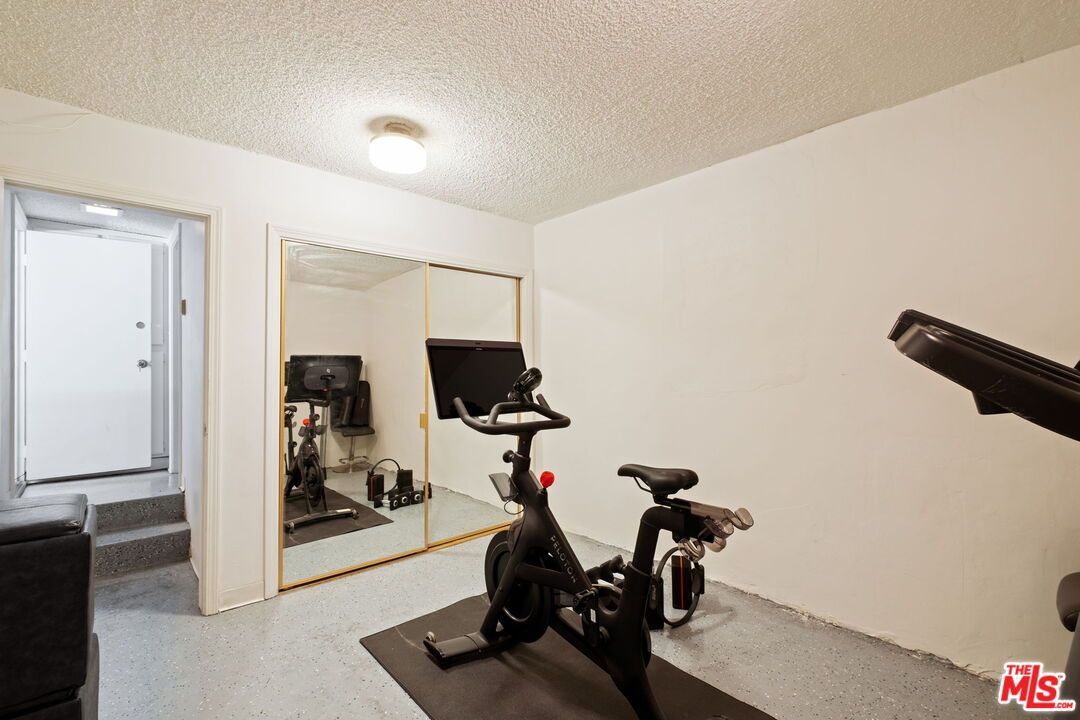 207 South Oakland Avenue, Unit A Pasadena, CA 91101 - Photo 37 of 41 a view of a workspace with furniture and a gym machine