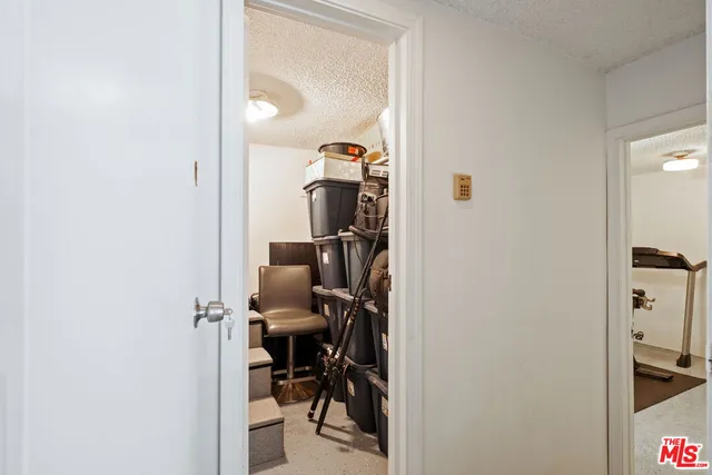 a view of a multi story residential apartment building with a yard