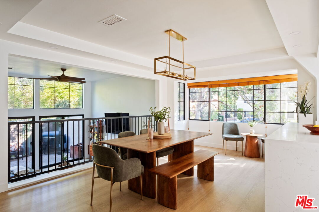 207 South Oakland Avenue, Unit A Pasadena, CA 91101 - Photo 10 of 41 a dining room with furniture a chandelier and wooden floor