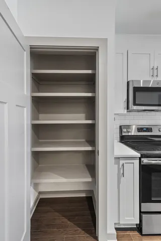 a view of storage and utility room with empty racks