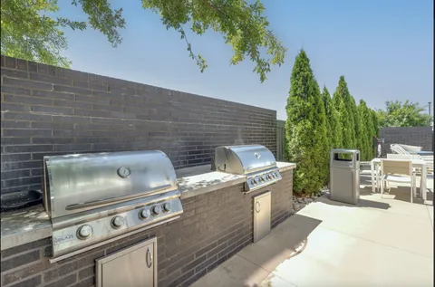 a stove top oven sitting inside of a kitchen