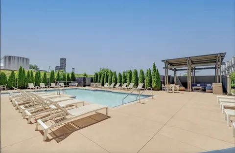 a view of a swimming pool and a patio