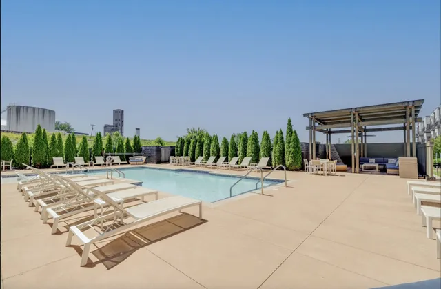 a view of a swimming pool and a patio