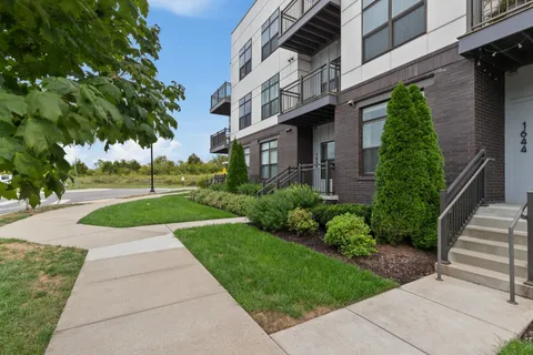 a view of a building with a yard