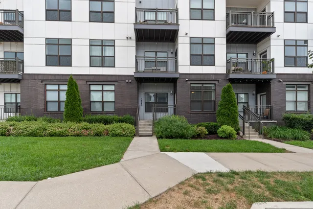 a view of a building with a yard