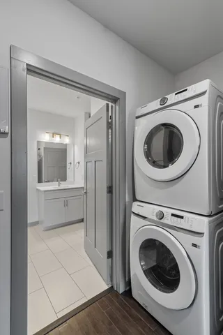 a view of a hallway with washer and dryer
