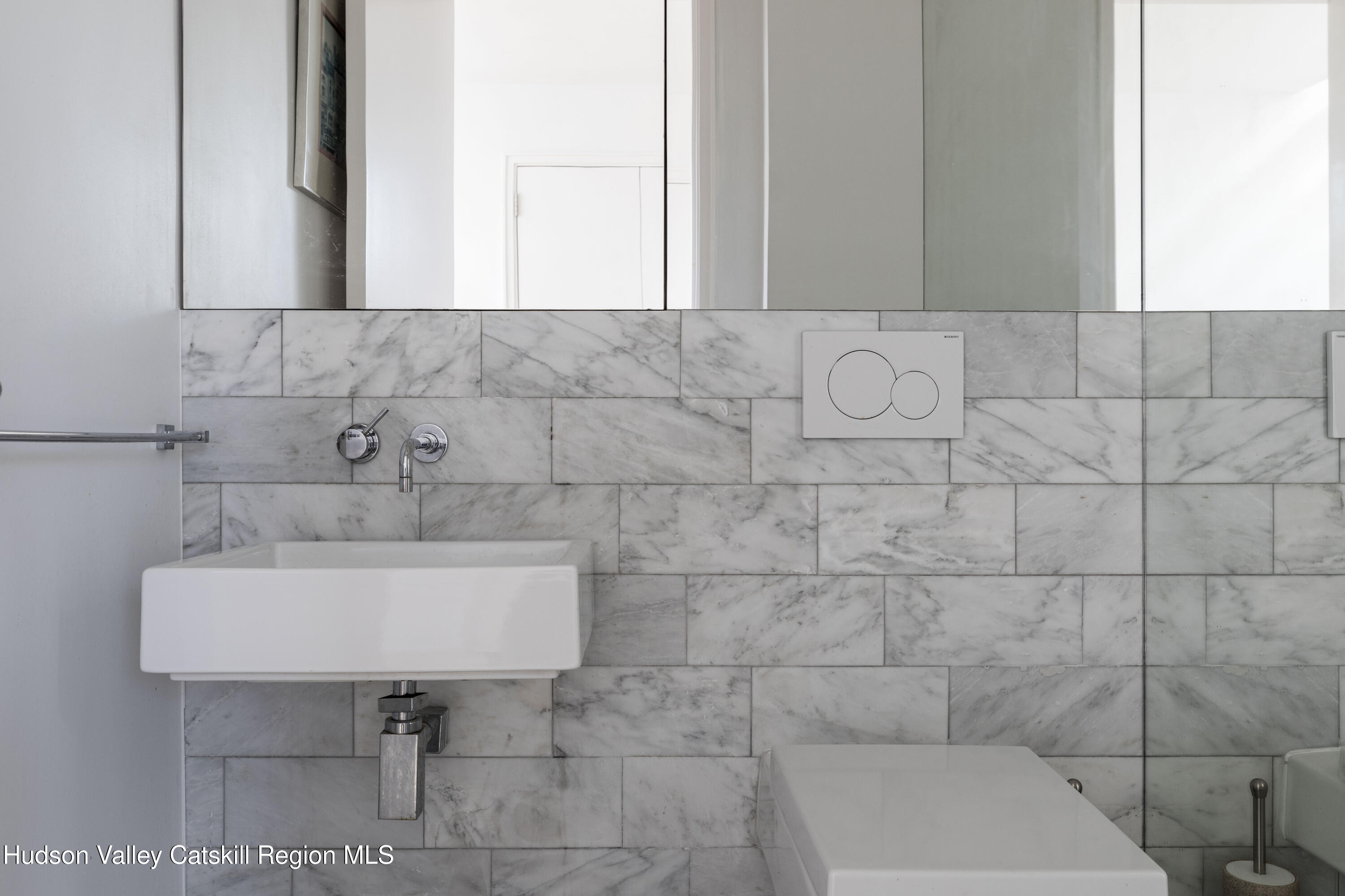 12 Jacob Strasse Road Windham, NY 12496 - Photo 18 of 54 a bathroom with a sink a toilet and mirror