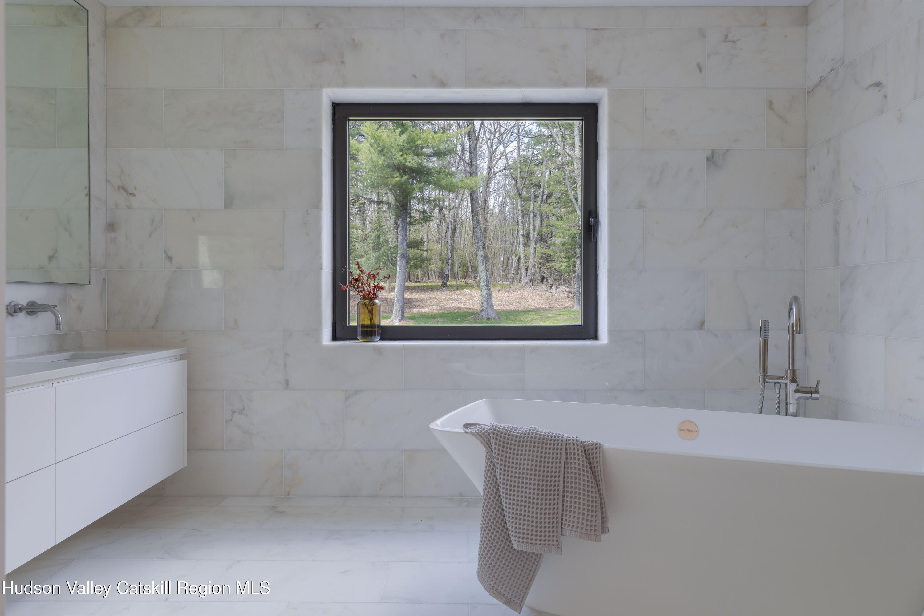 12 Jacob Strasse Road Windham, NY 12496 - Photo 34 of 54 a bathroom with a tub a sink and a window