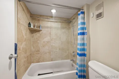 a bathroom with a shower and a bathtub