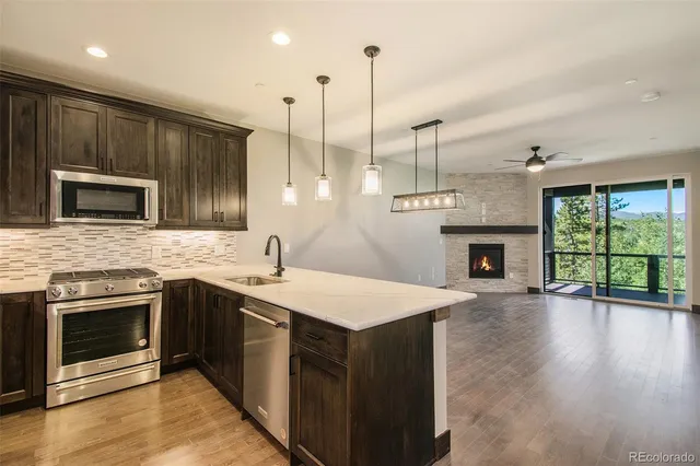 a kitchen with a sink stove and microwave