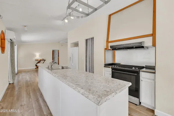 a view of dining room with furniture and chandelier fan