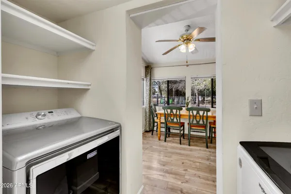 a front view of a house with a yard covered with snow