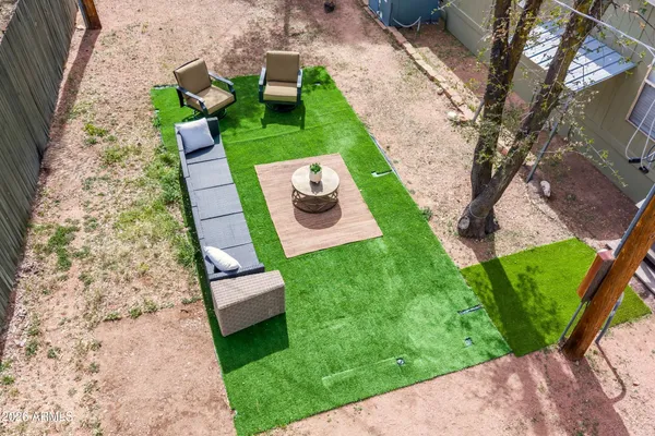 an aerial view of residential houses with outdoor space