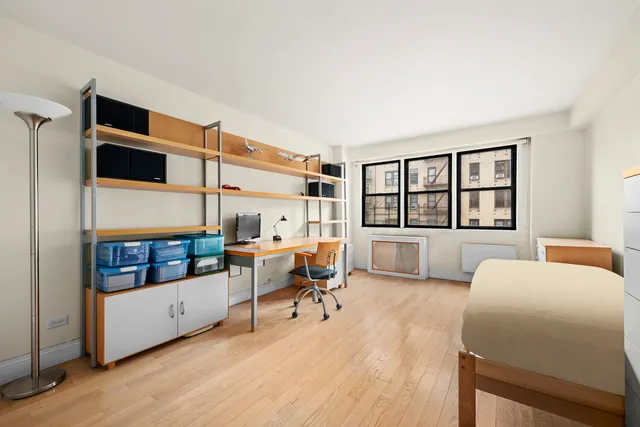 a bed room with a bed and a window