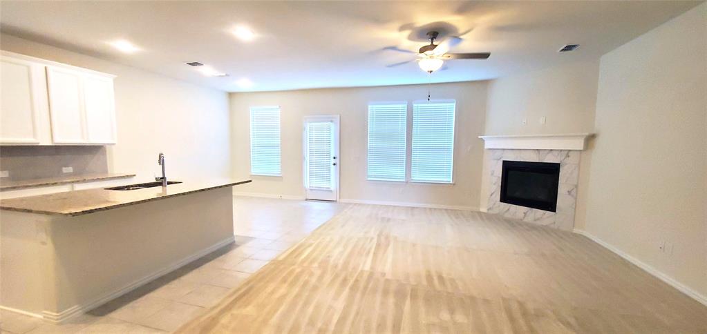 2016 Robert Street Anna, TX 75409 - Photo 2 of 8 a view of a kitchen with a sink and a fireplace