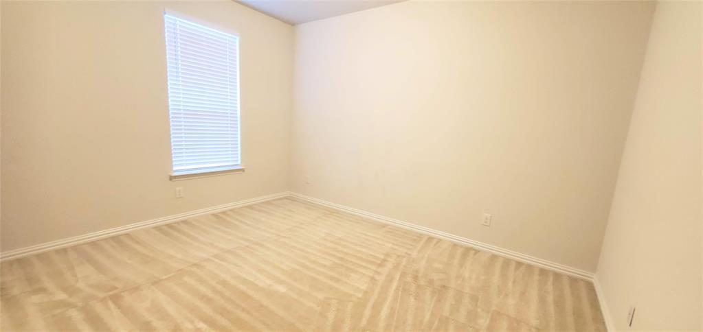 2016 Robert Street Anna, TX 75409 - Photo 5 of 8 a view of an empty room with a window