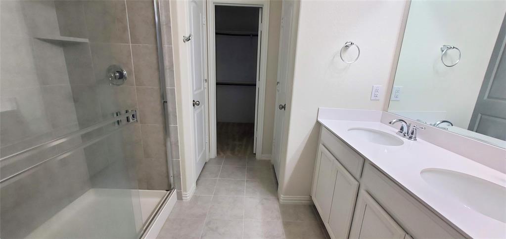 2016 Robert Street Anna, TX 75409 - Photo 7 of 8 a bathroom with a sink and a mirror with bathtub