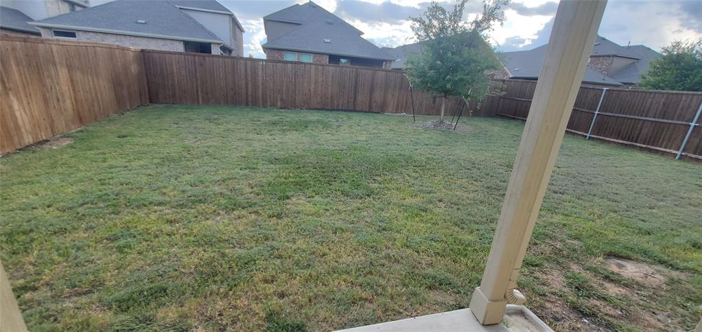 2016 Robert Street Anna, TX 75409 - Photo 8 of 8 a backyard of a house with lots of green space