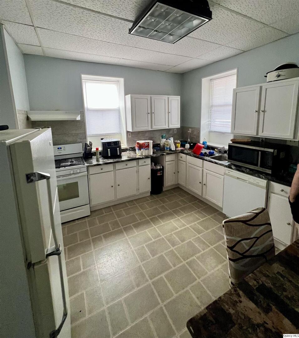 801 Monroe Street Quincy, IL 62301 - Photo 26 of 34 a kitchen with a sink appliances and cabinets