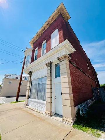 a view of a house with a street