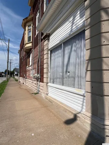 a view of a car in front of a house